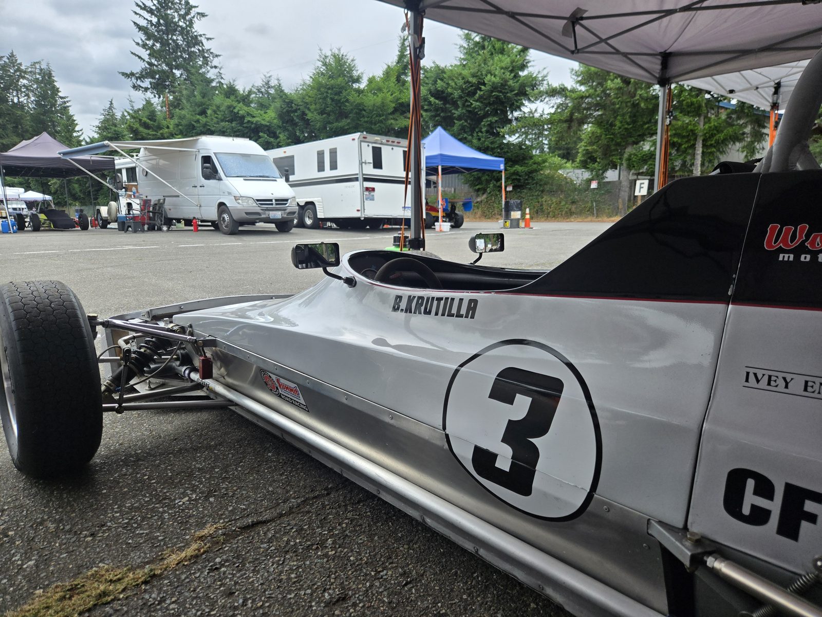 Close-up of the car's side: B. Krutilla name above the number 3 roundel