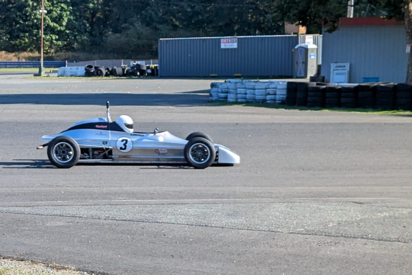 The number 3 Crosslé on track, side view
